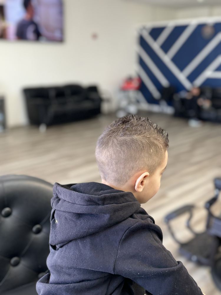 Fade haircut with a crisp, clean line up at NFL Cuts barbershop in Peoria, AZ
