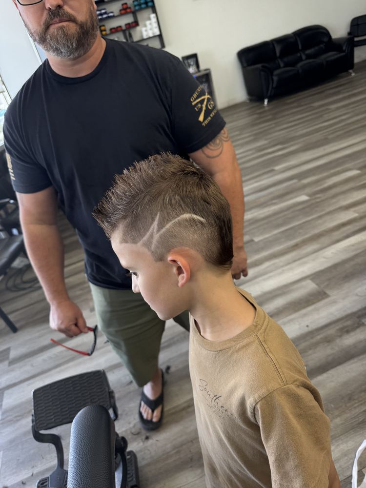 Kids haircut with a custom shaved lightning bolt design at NFL Cuts in Peoria, AZ