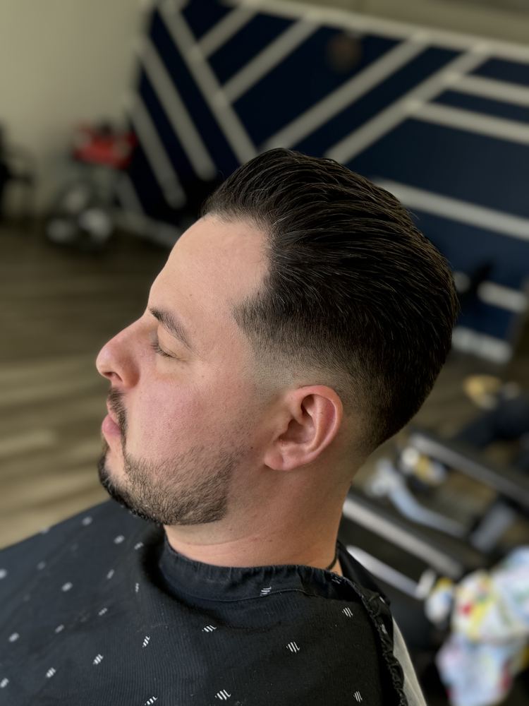 High fade with pompadour styled at NFL Cuts barbershop in Peoria, AZ